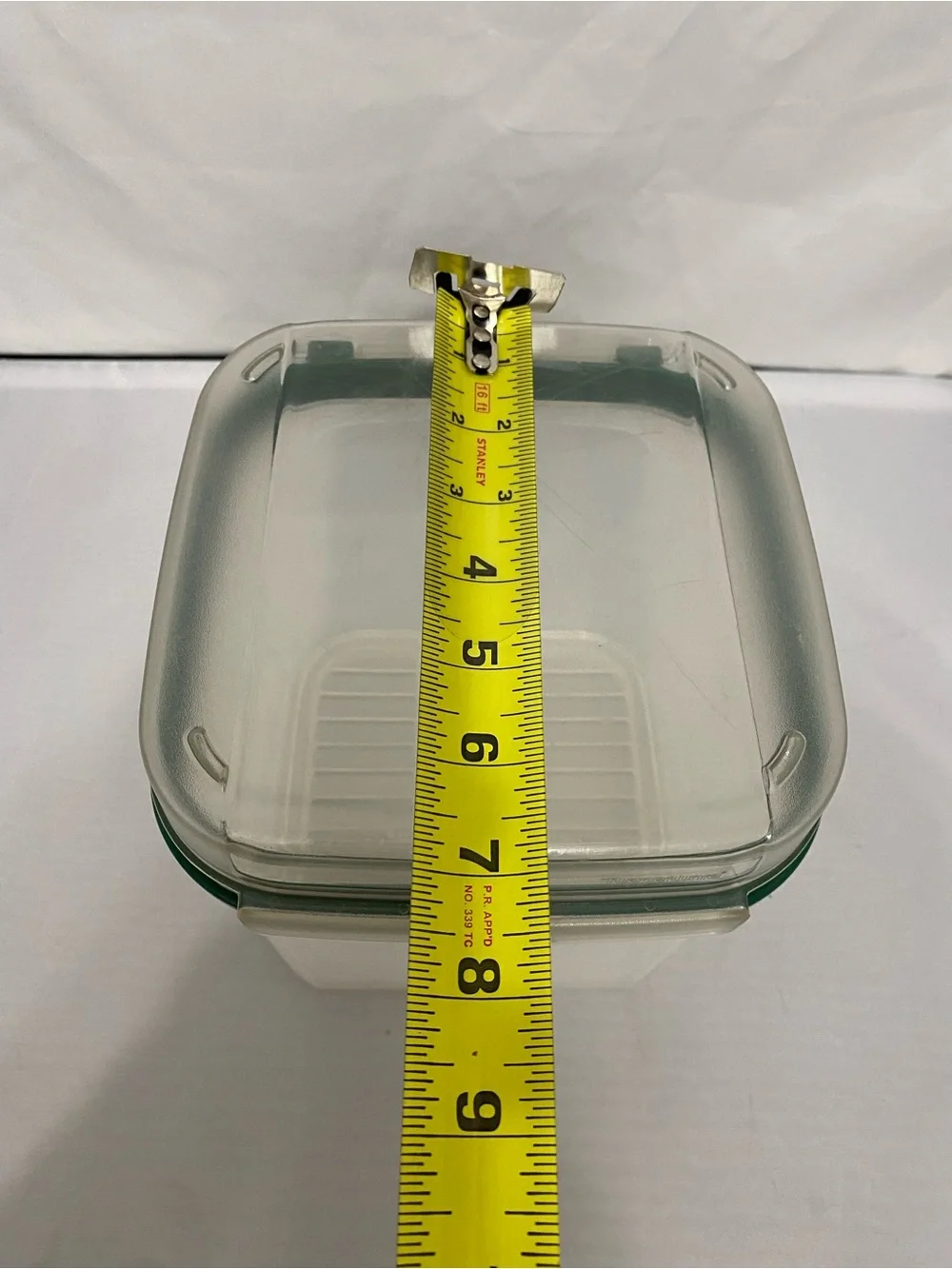 Tupperware Container with Green Rim and Flip Top Lid